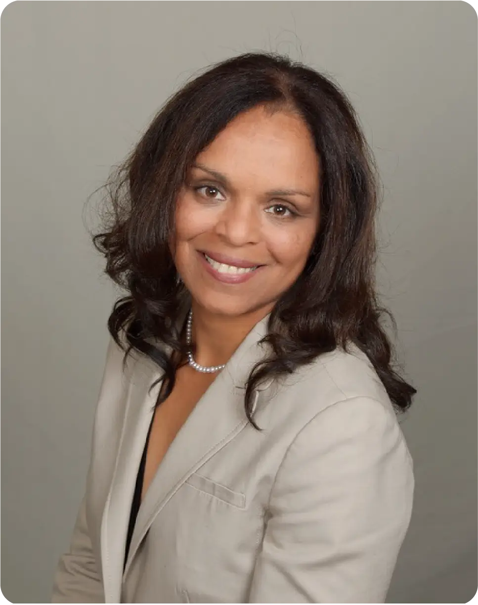Smiling woman in a white blazer.